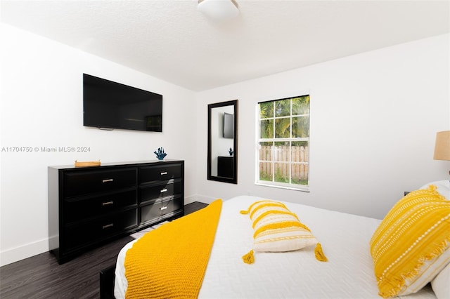 bedroom featuring dark hardwood / wood-style floors