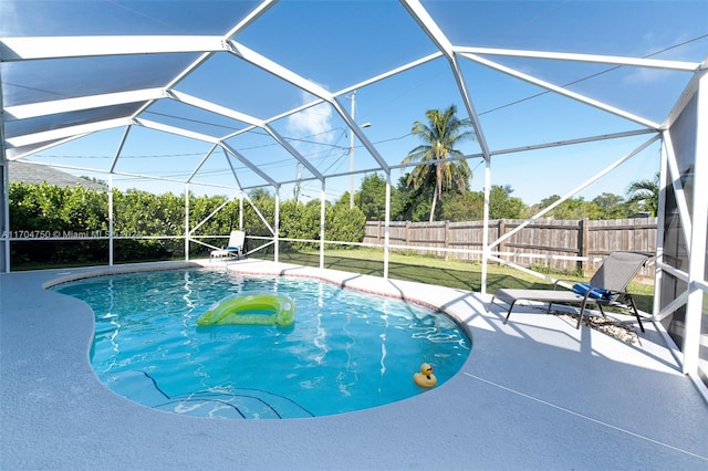 view of pool featuring a lanai and a patio