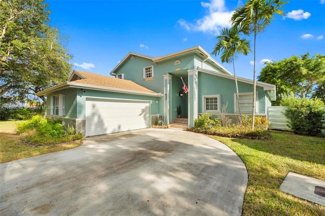 view of front of home with a garage and a front yard