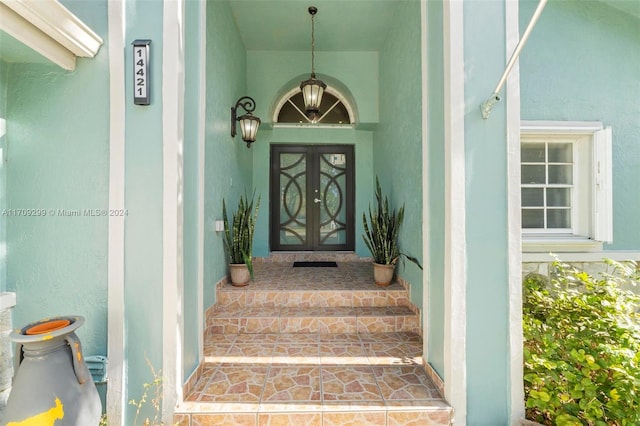 view of exterior entry featuring french doors