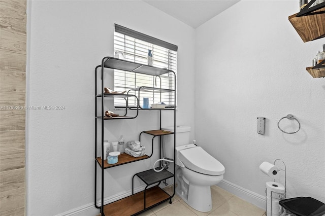 bathroom featuring tile patterned floors and toilet