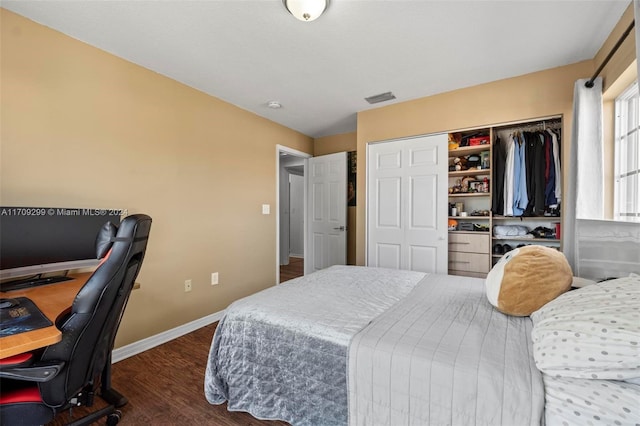 bedroom featuring a closet and dark hardwood / wood-style flooring