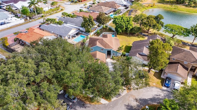 birds eye view of property with a water view