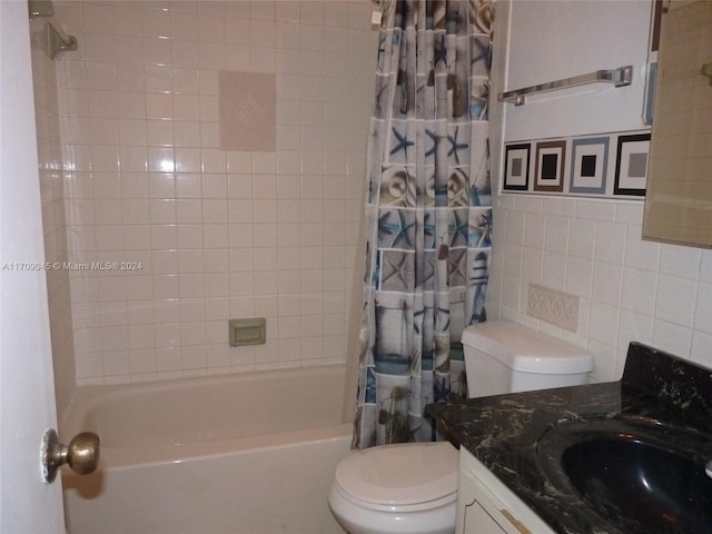 full bathroom featuring vanity, toilet, tile walls, and shower / tub combo with curtain