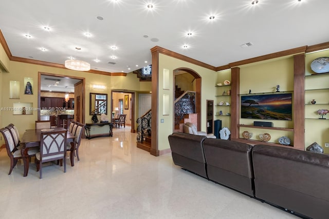 living room featuring built in features and ornamental molding