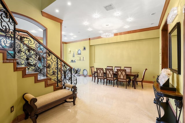 interior space with carpet flooring, crown molding, and a chandelier