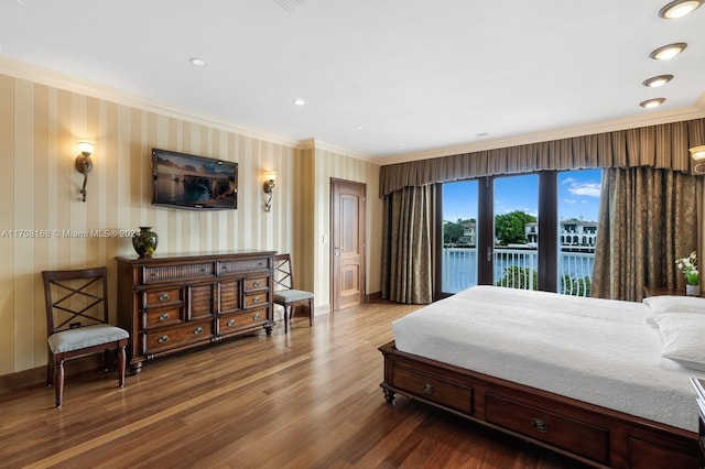 bedroom with access to outside, hardwood / wood-style flooring, and ornamental molding