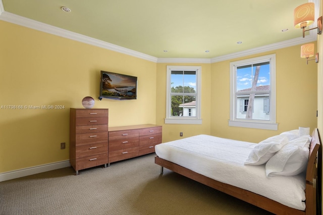 carpeted bedroom featuring crown molding