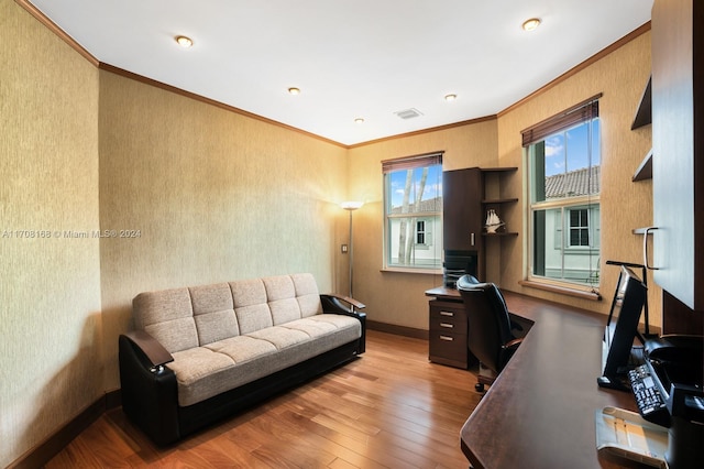 office with hardwood / wood-style floors and ornamental molding