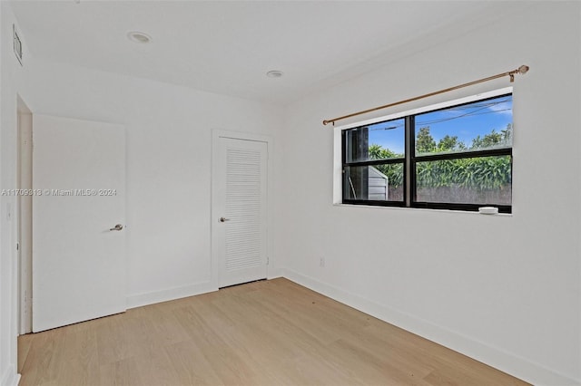 spare room featuring light hardwood / wood-style flooring