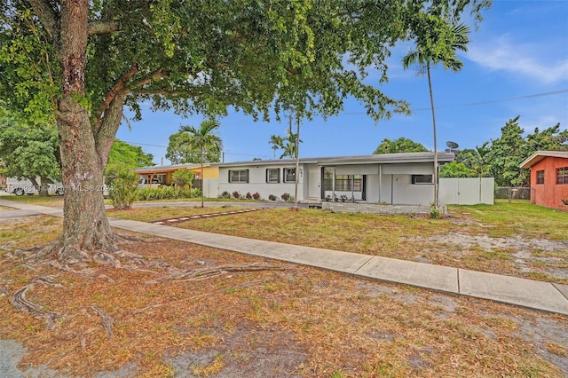 ranch-style house with a front yard