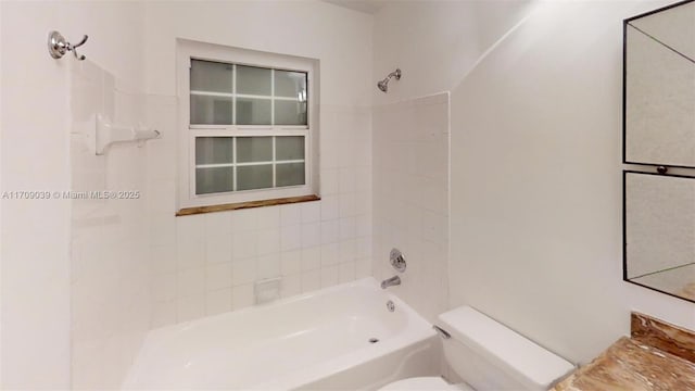 bathroom with toilet and shower / tub combination