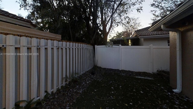 view of yard with a fenced backyard