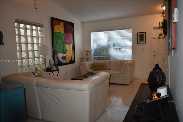 living room featuring light tile patterned flooring and lofted ceiling