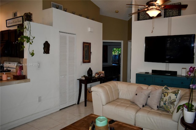 living room featuring ceiling fan and light tile patterned floors