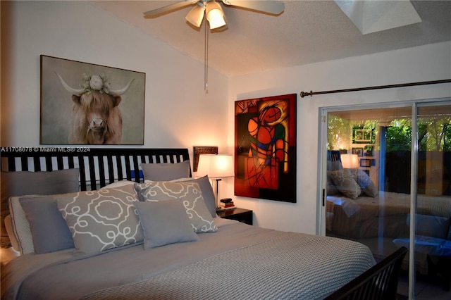 bedroom with ceiling fan, access to exterior, and lofted ceiling