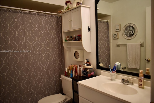 bathroom with vanity and toilet