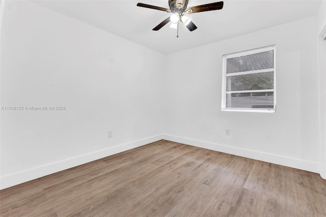 spare room with ceiling fan and light hardwood / wood-style floors