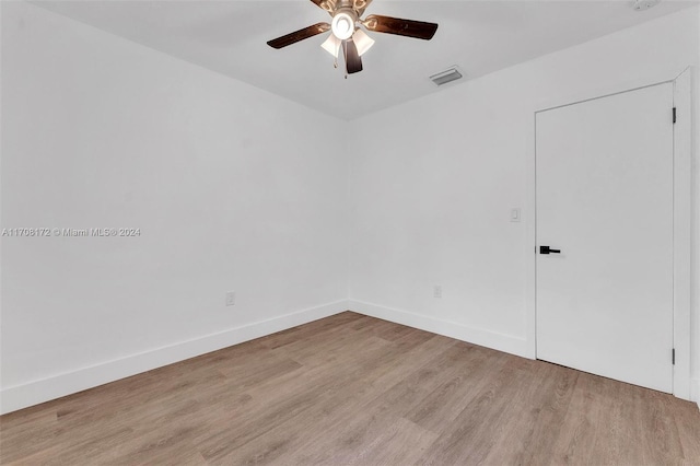 spare room featuring ceiling fan and light hardwood / wood-style flooring