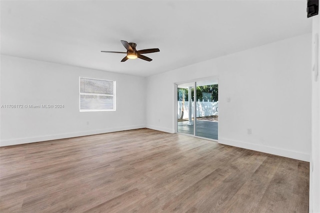 unfurnished room featuring light hardwood / wood-style flooring and ceiling fan