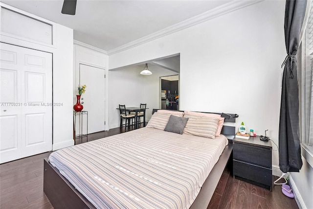 bedroom featuring crown molding, ceiling fan, and dark hardwood / wood-style floors