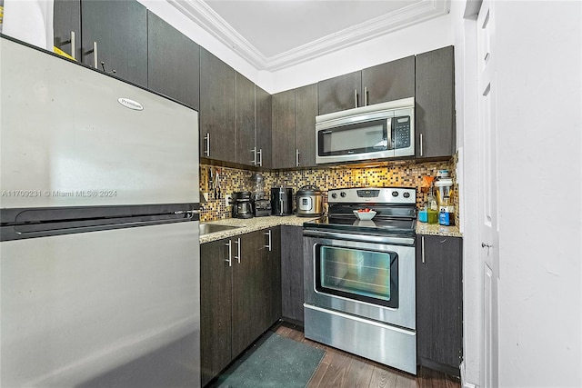 kitchen featuring crown molding, dark hardwood / wood-style flooring, stainless steel appliances, and dark brown cabinets