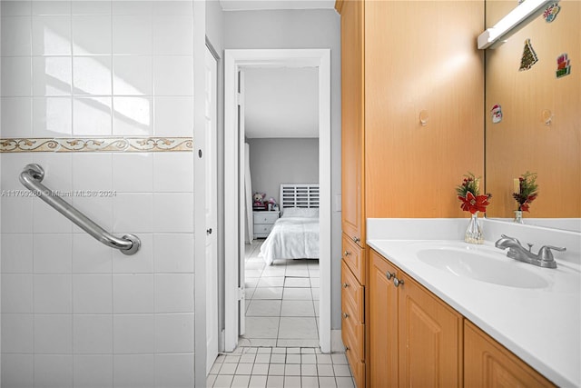 bathroom with tile patterned floors and vanity