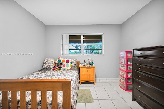 bedroom featuring light tile patterned floors