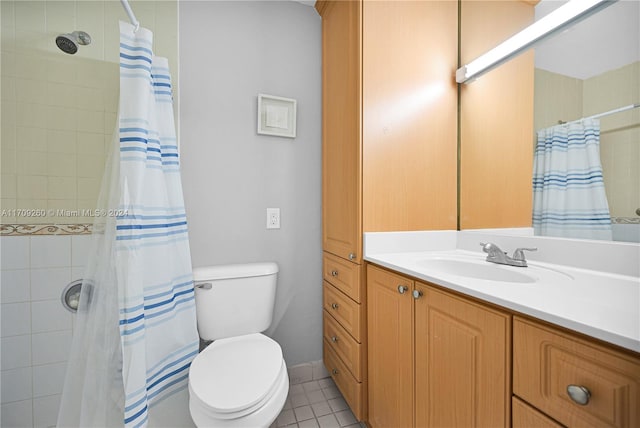 bathroom with a shower with shower curtain, vanity, tile patterned floors, and toilet