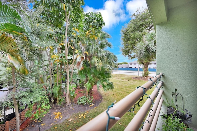 view of yard with a balcony