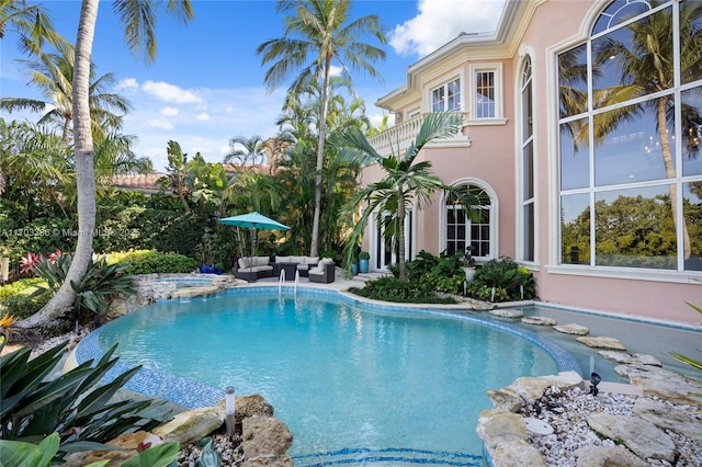 view of pool featuring an in ground hot tub and an outdoor hangout area