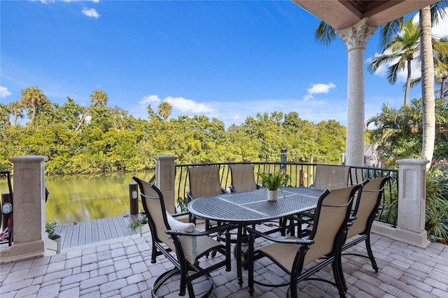 view of patio with a water view