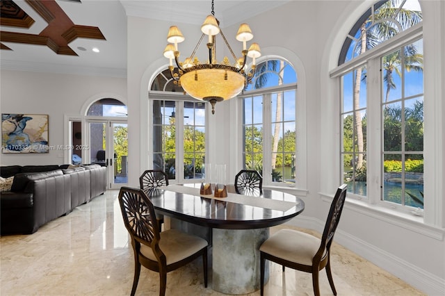 dining space with crown molding, plenty of natural light, a chandelier, and french doors