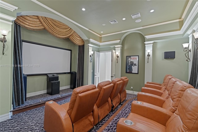 cinema room featuring crown molding and ornate columns