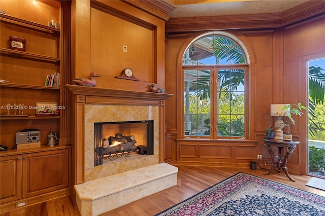 sitting room featuring wood-type flooring and a fireplace