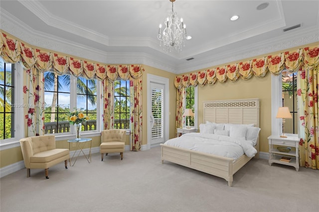 carpeted bedroom with crown molding, a tray ceiling, and an inviting chandelier