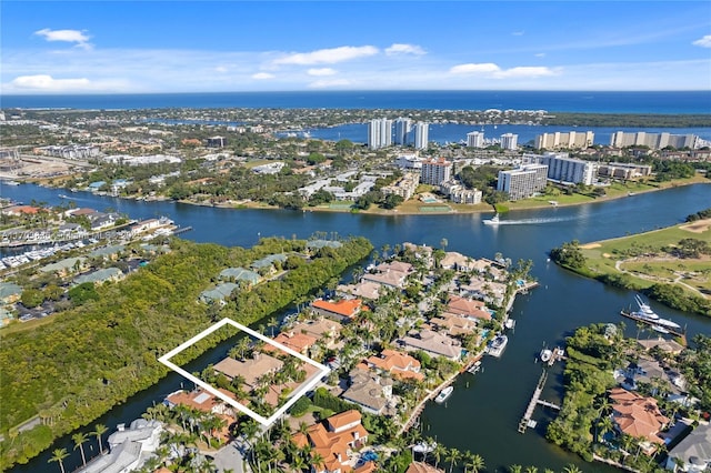 birds eye view of property with a water view