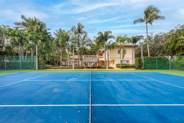 view of sport court featuring basketball hoop