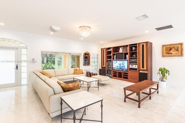 living room with a notable chandelier