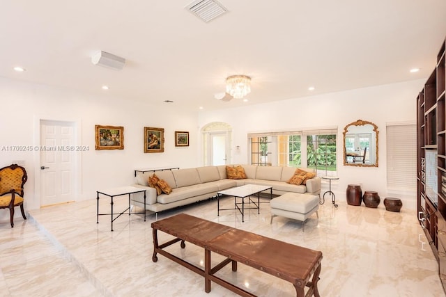 living room with an inviting chandelier