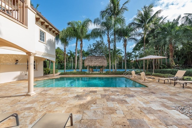 view of swimming pool with a gazebo and a patio