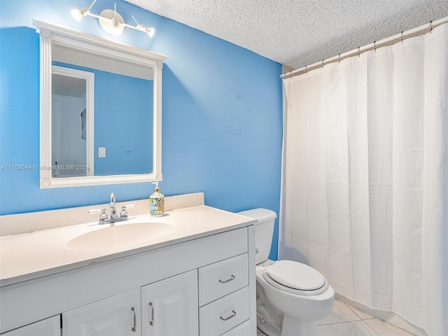 bathroom with a shower with curtain, vanity, a textured ceiling, tile patterned flooring, and toilet