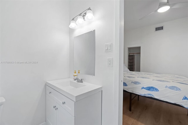 bathroom featuring ceiling fan, vanity, and hardwood / wood-style flooring