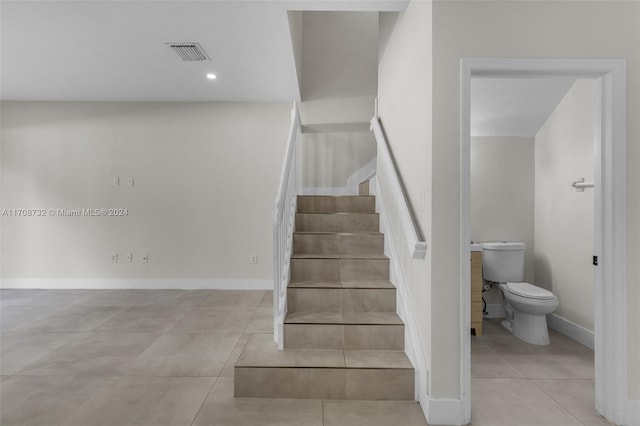 stairs with tile patterned flooring