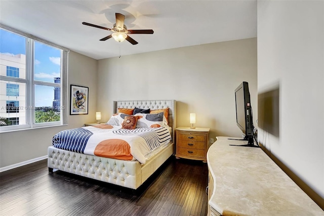 bedroom featuring ceiling fan and dark hardwood / wood-style floors