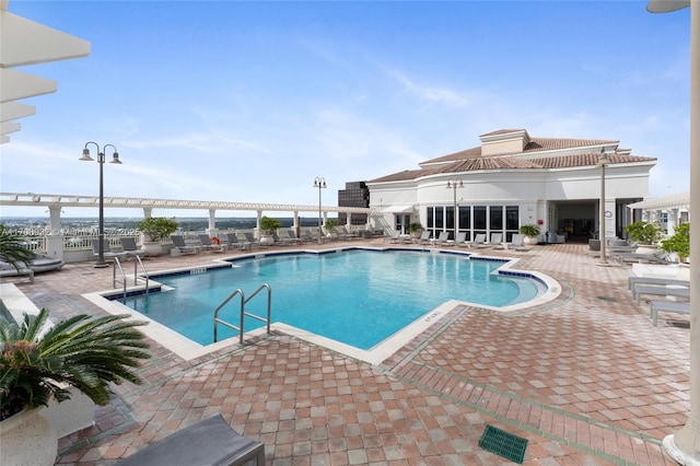 view of swimming pool with a patio area