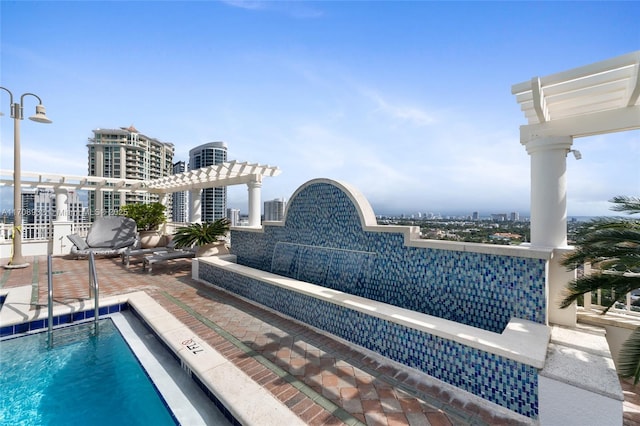 view of pool with an outdoor living space, a pergola, and a patio area