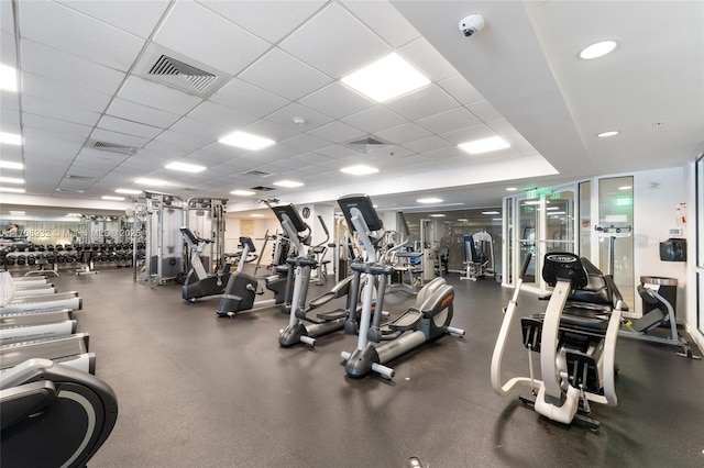 gym featuring a paneled ceiling