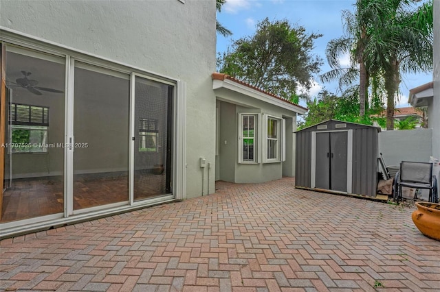 view of patio featuring a storage shed