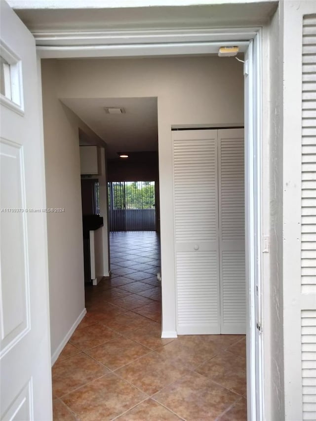 hallway featuring light tile patterned flooring